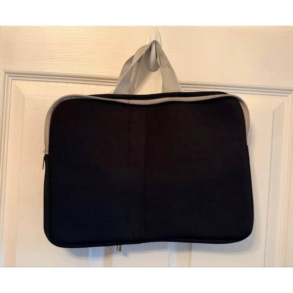 Black laptop sleeve bag features gray zipper compartment carrying handle.